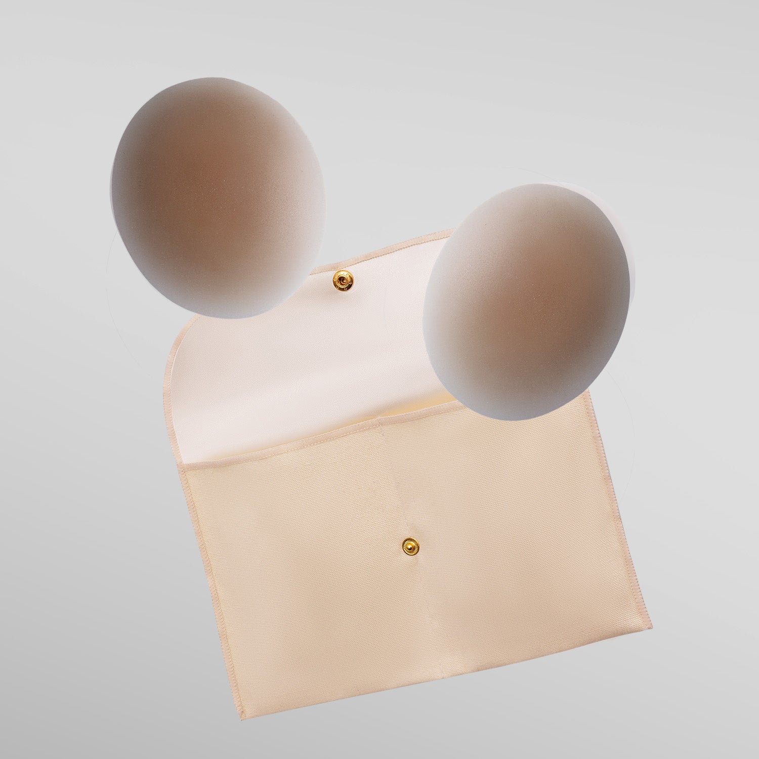 Two Naturelle petals in tan shade with storage pouch