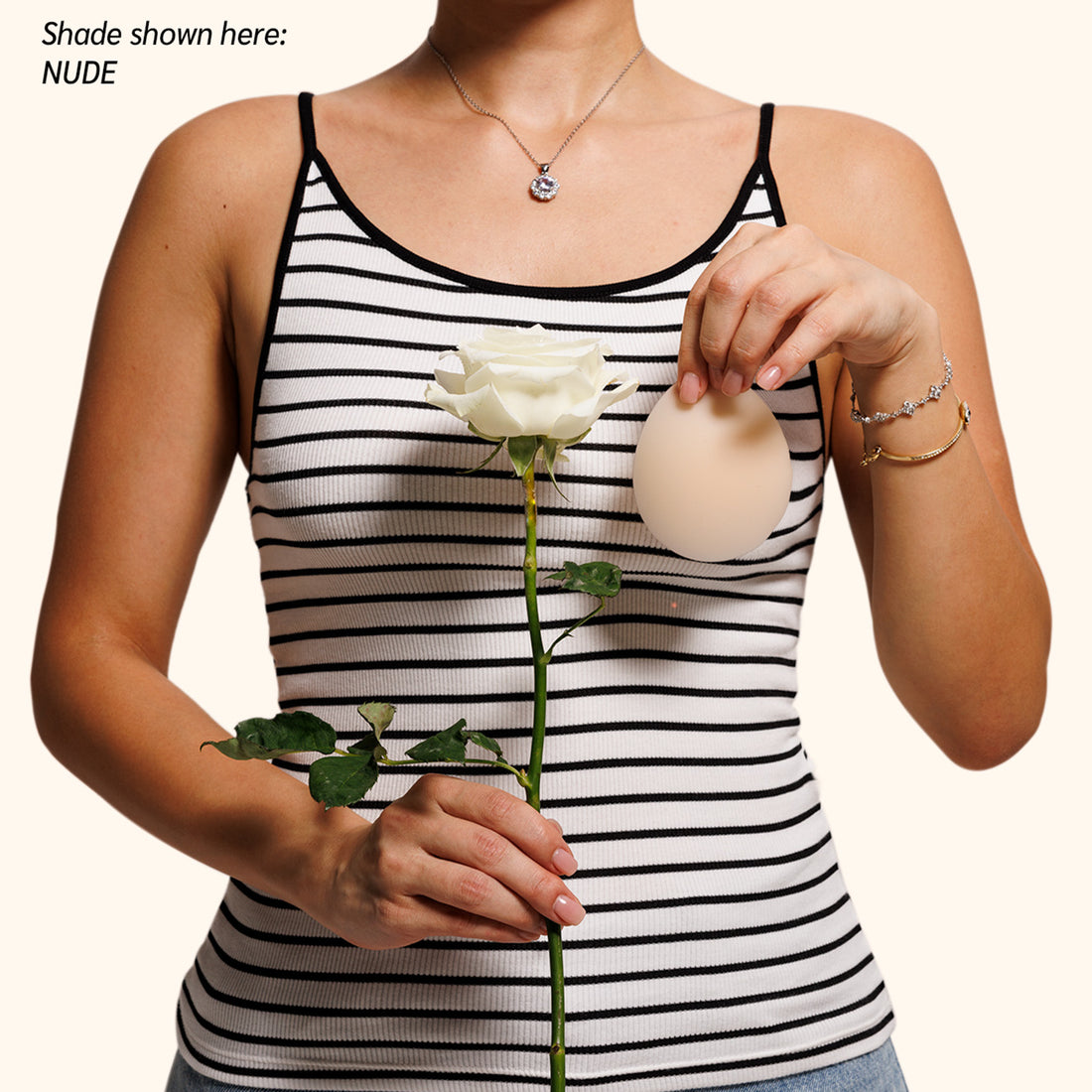 Woman in striped top showing invisible coverage with Naturelle petals